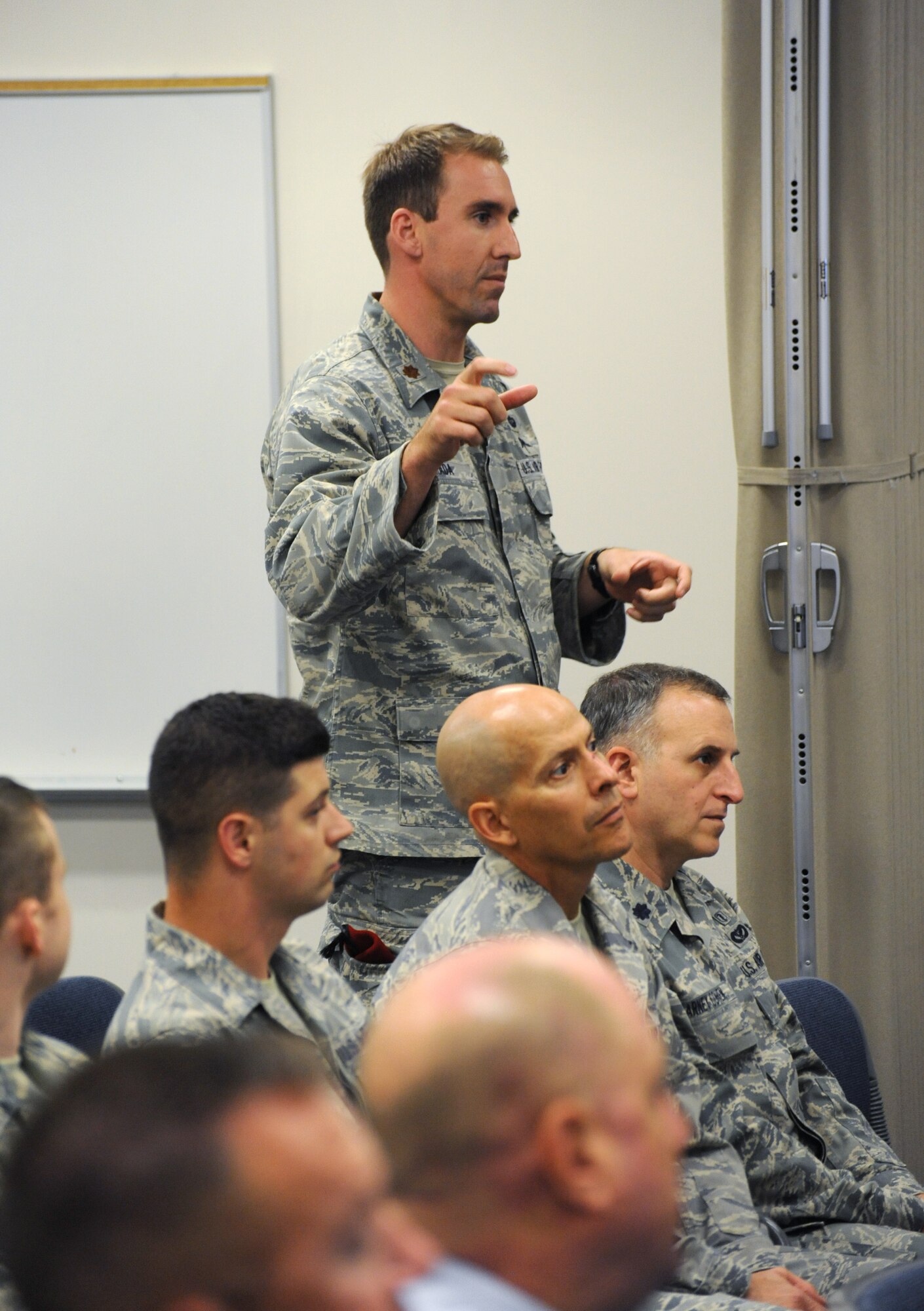 Air Force Maj. Tarek Awada, 125th Special Tactics Squadron commander, asks a question of Army Gen. Frank J. Grass, director of the National Guard, during a town hall event, Aug. 15, 2015, Portland Air National Guard Base, Ore. (U.S. Air National Guard photo by Tech. Sgt. John Hughel, 142nd Fighter Wing Public Affairs/Released)
