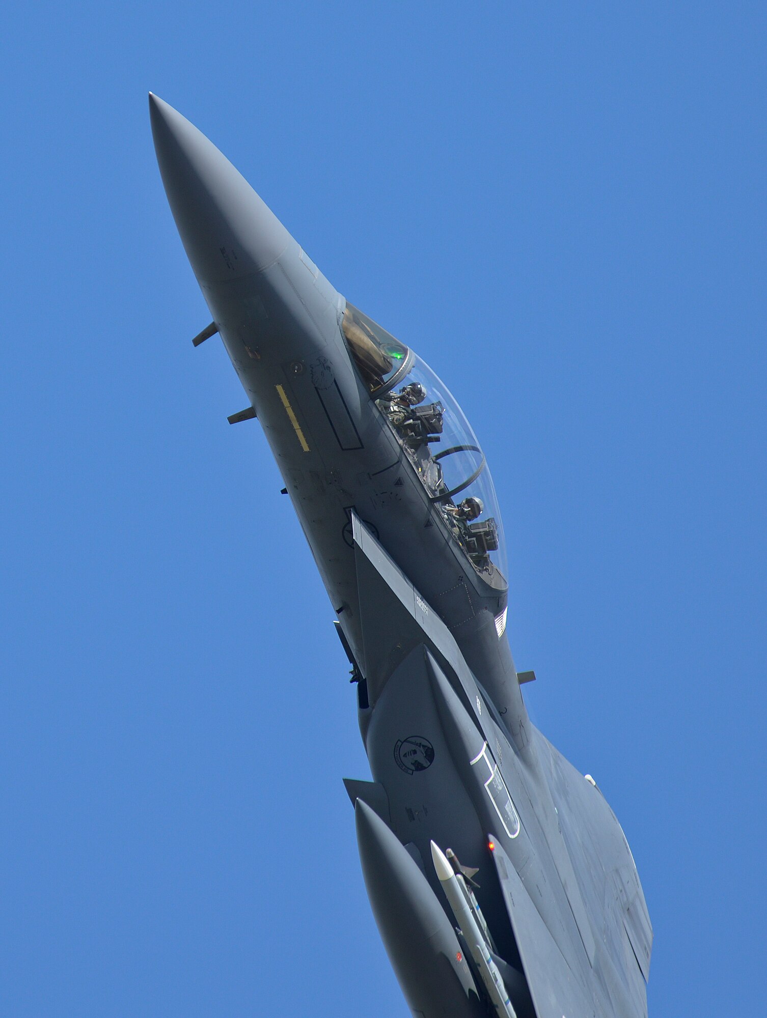 An F-15E Strike Eagle, assigned to the 48th Fighter Wing, flies over Royal Air Force Lakenheath, England, during a training sortie, Aug. 17, 2015. The 48th FW is responsible for providing air combat superiority for United States Air Forces in Europe and Air Forces Africa area of responsibility. (U.S. Air Force photo by Senior Airman Trevor T. McBride/Released)