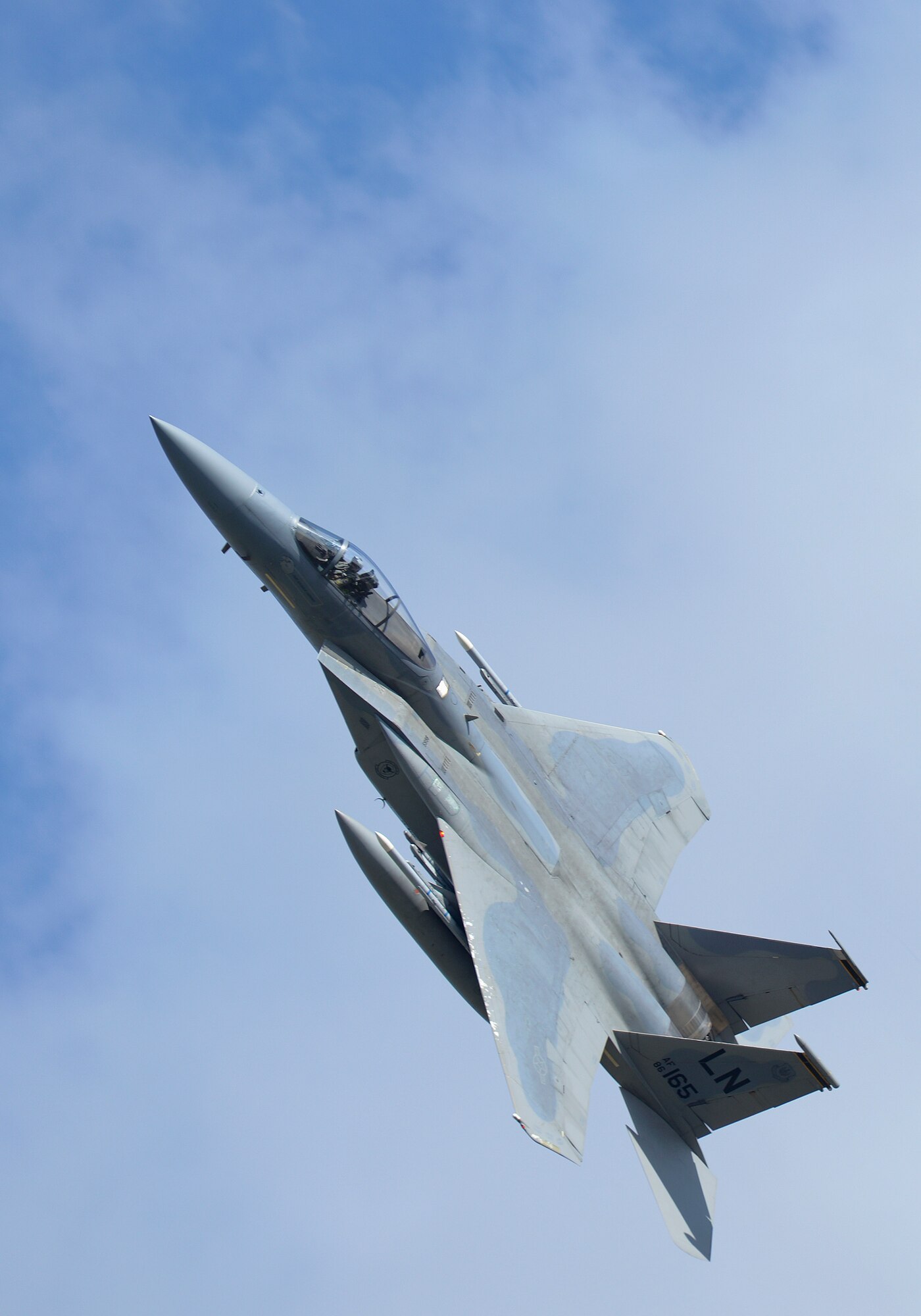 An F-15E Strike Eagle, assigned to the 48th Fighter Wing, flies over Royal Air Force Lakenheath, England, during a training sortie, Aug. 17, 2015. The 48th FW is responsible for providing air combat superiority for United States Air Forces in Europe and Air Forces Africa area of responsibility. (U.S. Air Force photo by Senior Airman Trevor T. McBride/Released)