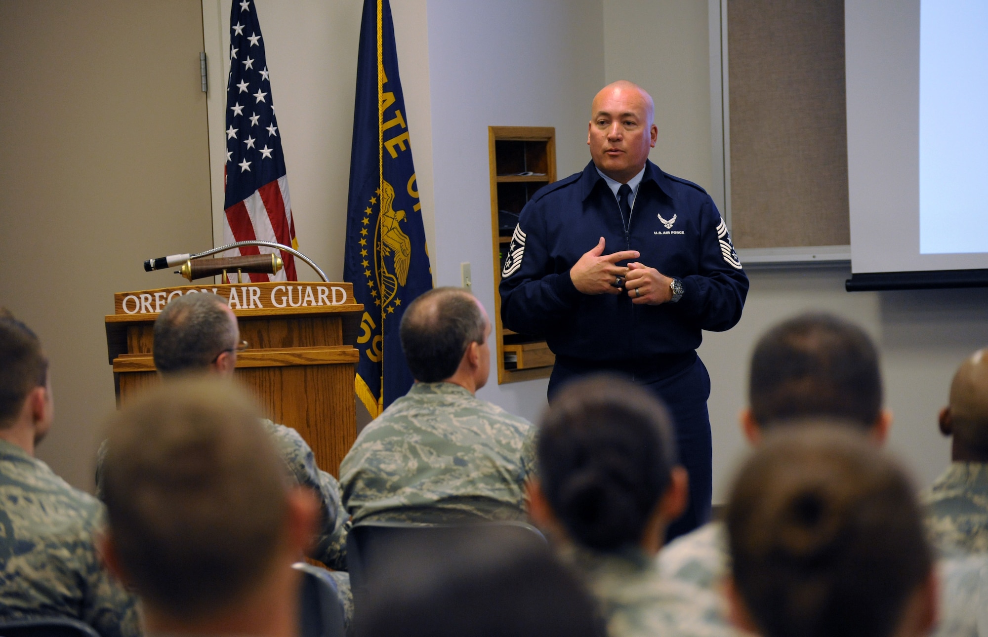 Air Force Chief Master Sgt. Mitchell O. Brush, Senior enlisted advisor for the National Guard Bureau, address those in attendance at a town hall event at the Portland Air National Guard Base, Ore., Aug. 15, 2015. (U.S. Air National Guard photo by Tech. Sgt. John Hughel, 142nd Fighter Wing Public Affairs/Released)