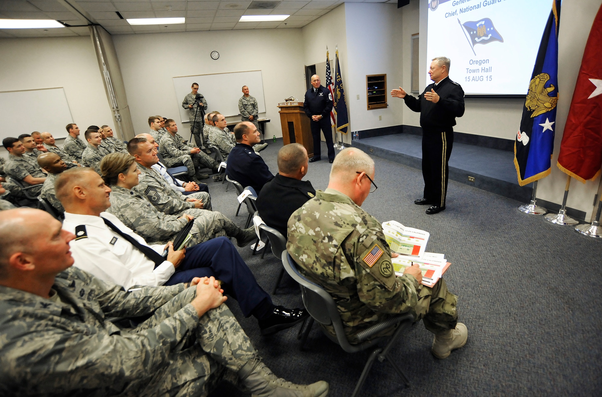 Army Gen. Frank J. Grass, Director of the National Guard Bureau and Air Force Chief Master Sgt. Mitchell O. Brush lead a town hall event at the Portland Air National Guard Base, Ore., Aug. 15, 2015. Both NGB leaders spent the day in Portland attending a variety of events. (U.S. Air National Guard photo by Tech. Sgt. John Hughel, 142nd Fighter Wing Public Affairs/Released)