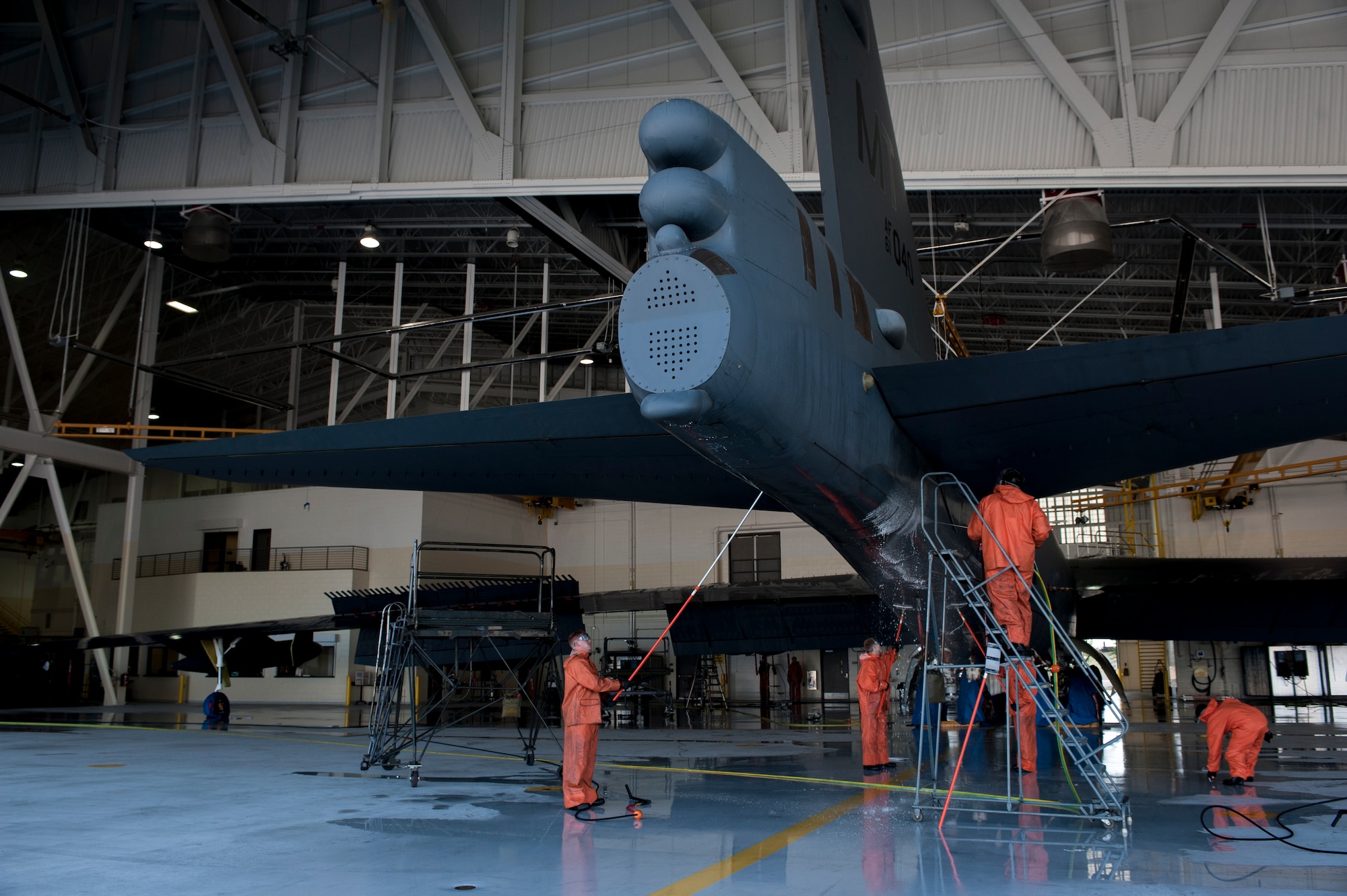 Airmen from the 5th Maintenance Squadron wash a B-52H Stratofortress at Minot Air Force Base, N.D., Aug. 4, 2015. B-52s are washed with specialized cleaning solutions to prevent corrosion and degradation of the aircraft’s frame, parts and shell. (U.S. Air Force photo/Senior Airman Stephanie Morris)