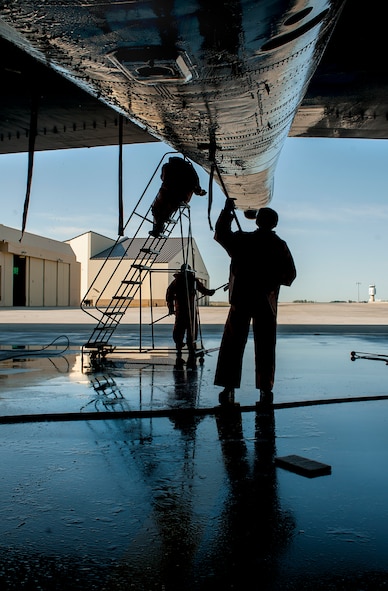 Airmen from the 5th Maintenance Squadron wash a B-52H Stratofortress at Minot Air Force Base, N.D., Aug. 4, 2015. B-52s are washed with specialized cleaning solutions to prevent corrosion and degradation of the aircraft’s frame, parts and shell. (U.S. Air Force photo/Senior Airman Stephanie Morris)