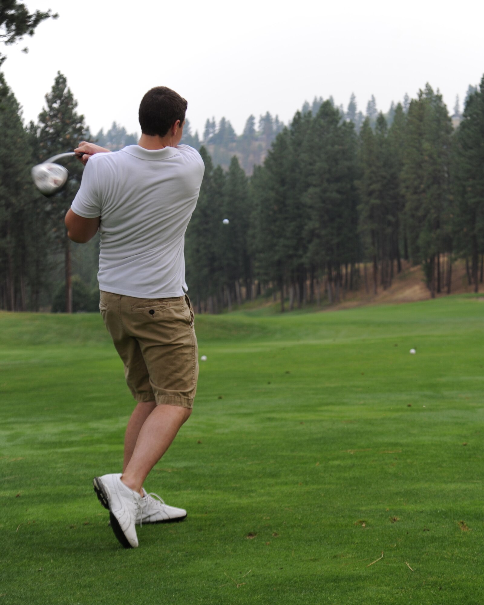 Second Lt. Matthew Heien, 92nd Maintenance Squadron Aerospace Ground Equipment flight officer in charge, drives a golf ball during the Wing Morale Golf Tournament Aug. 14, 2015, at Qualchan Golf Course in Spokane, Wash. The 92nd MXS and a multitude of other units participated in the golf tournament which was intended to boost Fairchild Airmen’s morale. (U.S. Air Force photo/Airman 1st Class Nicolo J. Daniello)