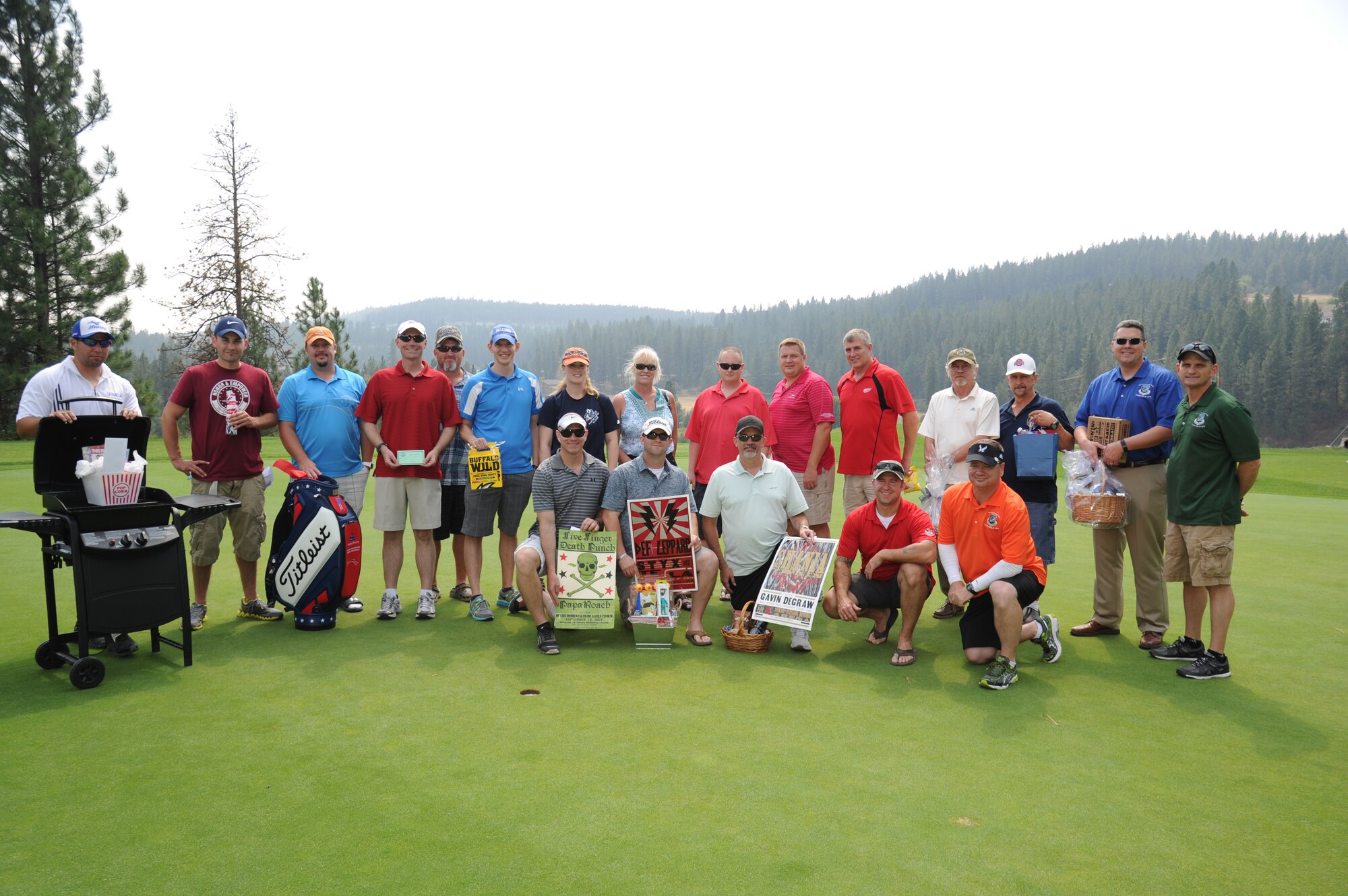 92nd Air Refueling Wing leadership pose for a picture with the golf and raffle winners Aug. 14, 2015, at Qualchan Golf Course in Spokane, Wash. The Wing Morale Golf Tournament was intended to boost morale of Fairchild’s Airmen. (U. S. Air Force photo/Airman 1st Class Nicolo J. Daniello)