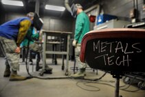 Airmen from the 5th Maintenance Squadron, work on creating a new storage rack at Minot Air Force Base, N.D., Aug. 14, 2015. The 5th MXS fabrication section provides a wide array of services including welding, metal fabrication, corrosion prevention and non-destructive inspections. (U.S. Air Force photo/Senior Airman Stephanie Morris)