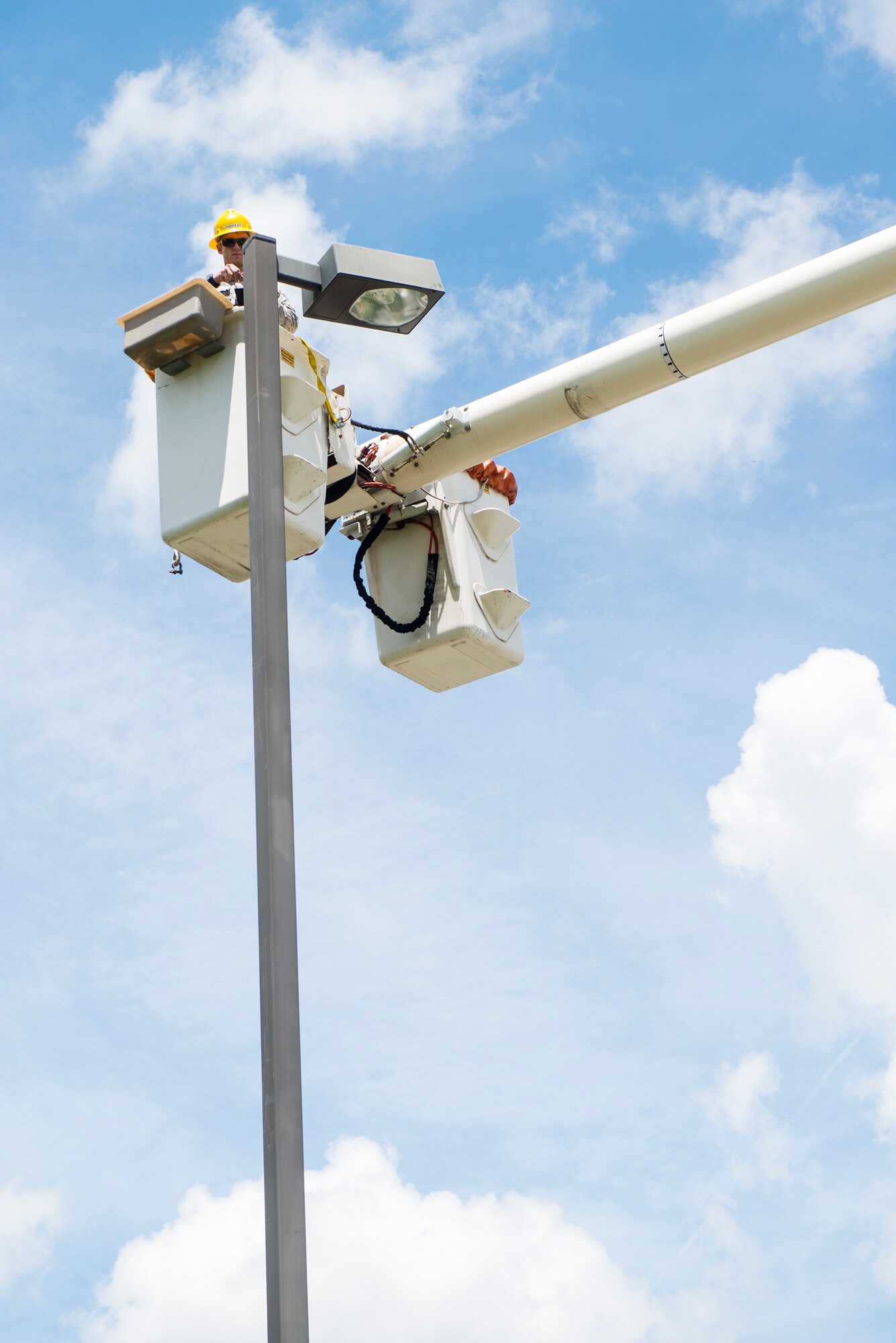 U.S. Air Force Senior Airman Richard Chandlee, 23d Civil Engineer Squadron electrical systems specialist, checks a light fixture Aug. 17, 2015, at Moody Air Force Base, Ga. The 23d CES weekly checks all streetlight fixtures on base and daily checks all airfield lighting to ensure they are functioning properly. (U.S. Air Force photo by Airman 1st Class Ceaira Tinsley/Released)