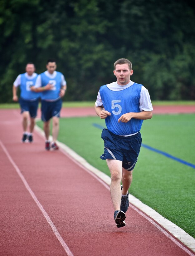 932nd Airlift Wing members run a mile and a half as part of the physical fitness requirement to be in the Air Force, Aug. 9, 2015, Scott Air Force Base, Illinois.  Air Force Airmen are tested on push ups, sit-ups and abdominal circumference and include height, weight and age to indicate a passing level of fitness. (U.S. Air Force photo / Tech. Sgt. Christopher Parr)