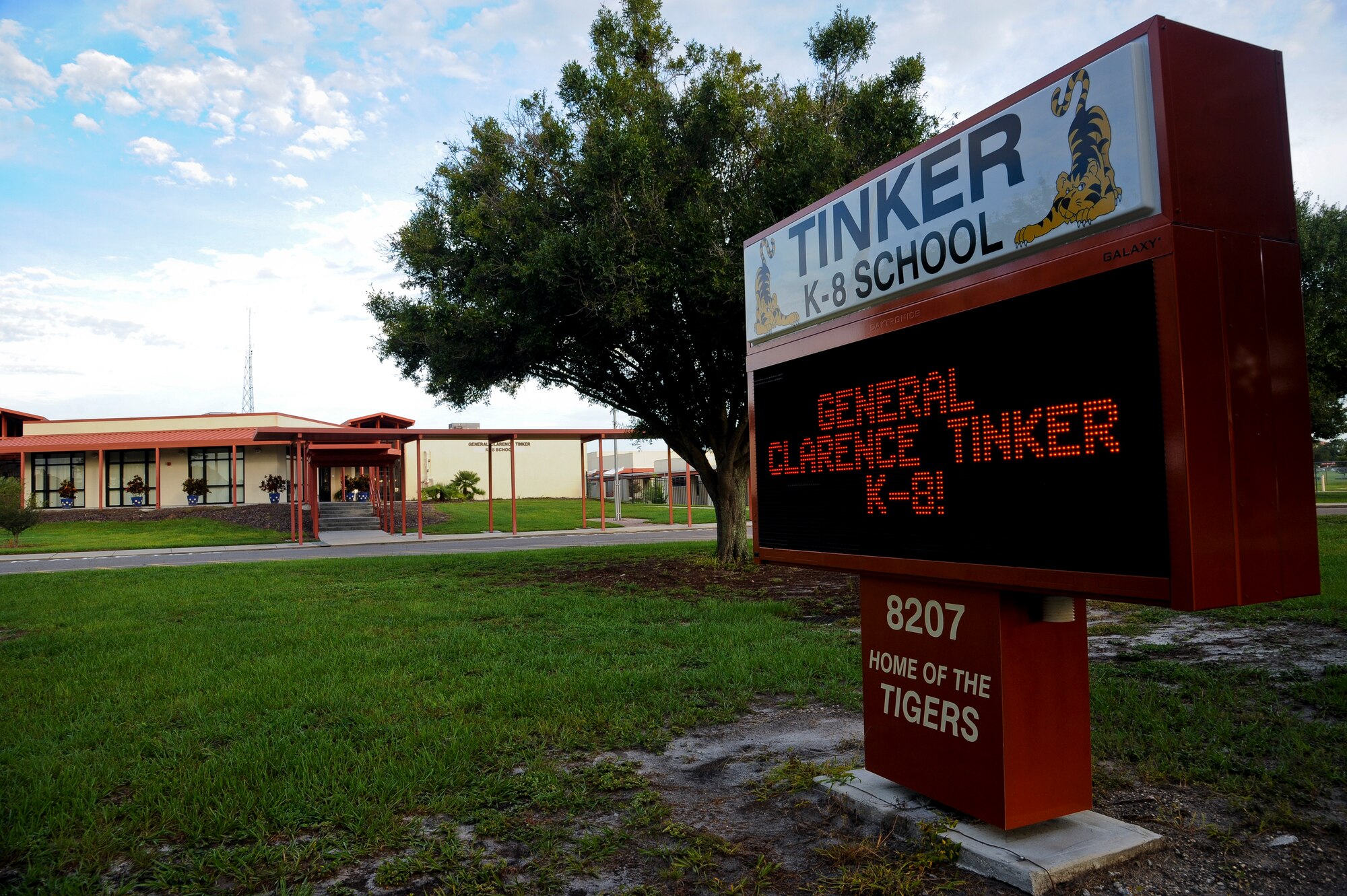 The marquee in front of General Clarence Tinker K-8 School displays the new grade range at MacDill Air Force Base, Fla., Aug. 14, 2015. Student registration hours are Monday through Thursday from 8:30-11:30 a.m. and 12:30-3:30 p.m. (U.S. Air Force photo by Airman 1st Class Danielle Quilla/Released)