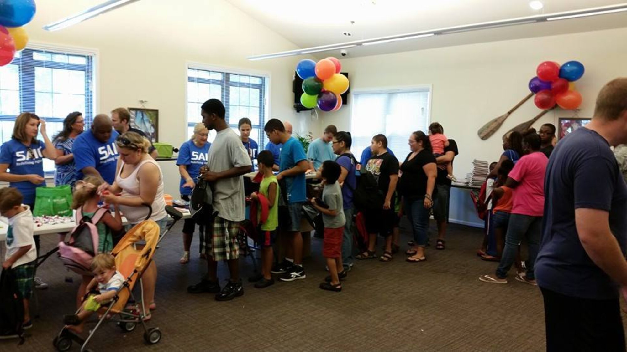 Military children at Joint Base Charleston - Air Base picked up school supplies for the 2015-2016 school year during the Operation Homefront Back to School Brigade event Aug. 13 at the Forest City community center.  Items such as notebooks, pens and pencils as well as calculators were donated by patrons of the Dollar Tree and were distributed by volunteers from Science Applications International Corporation. A second Back to School Brigade event was held at the Balfour Beatty community center at JB Charleston - Weapons Station later in the day. Between both locations, approximately 300 backpacks filled with supplies was distributed to military children. (Courtesy photo / 628th Force Support Squadron)

Nearly 300 Joint Base Charleston families were provided free back-to-school supplies Aug. 12, that were donated by patrons of Dollar Tree. One event took place on the Air Base at the Forest City Community Center and the other was on the Weapons Station at the Balfour Beatty Community Center.