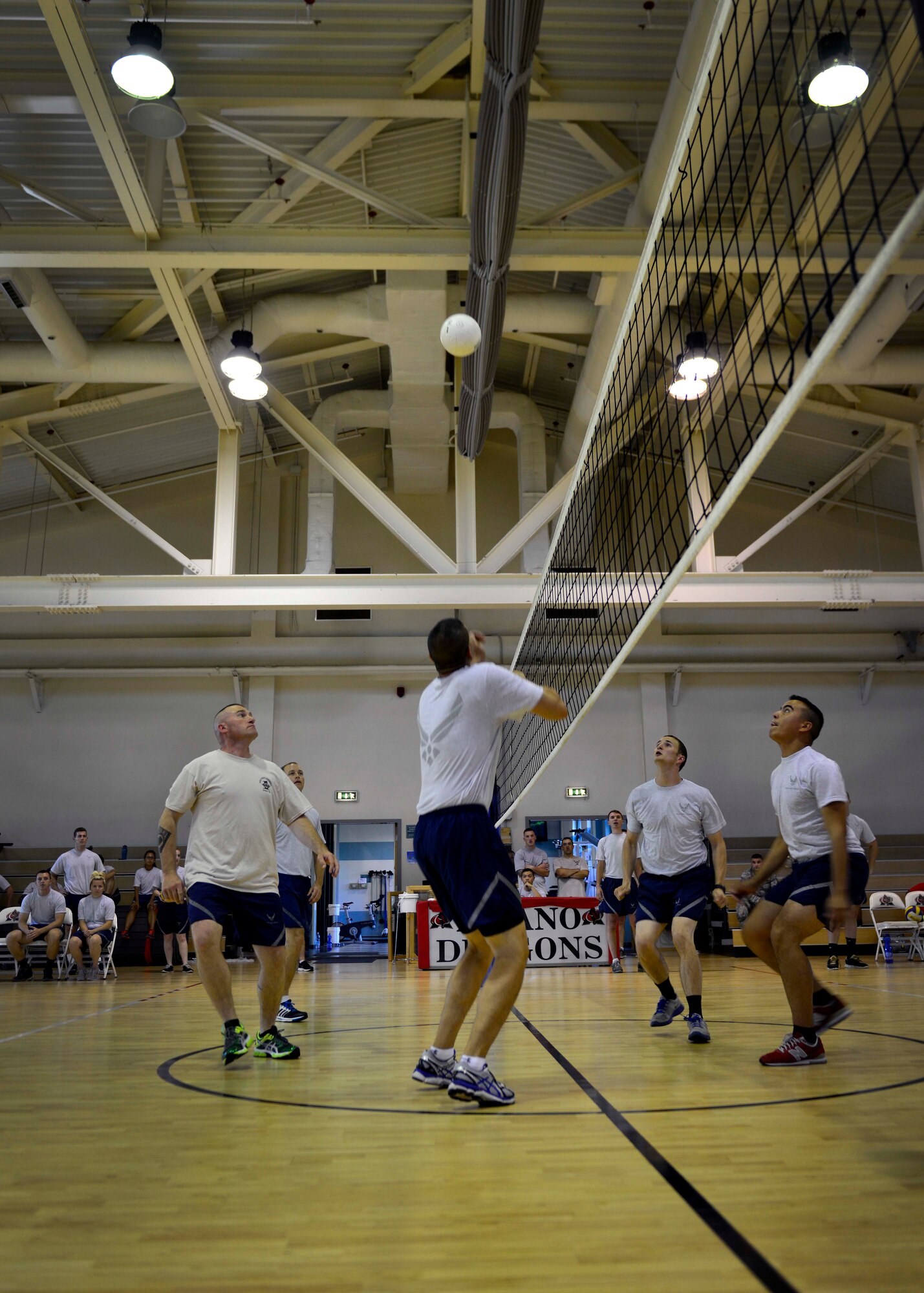 Senior enlisted leaders prepare to spike the ball during a volleyball match against Airman Leadership School, Aug. 14, 2015, at Aviano Air Base, Italy. The senior enlisted team brought home bragging rights after winning the four-game tournament. (U.S. Air Force photo by Airman 1st Class Cary Smith/Released)