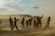 Observers are brushed with dusty wind after a C-130 Hercules took off from an austere runway used for training during RED FLAG-Alaska at Joint Base Elmendorf-Richardson, Alaska, Aug. 14, 2015. The training allowed C-130 aircrew to practice austere landings and take offs, combat offloads and supply drops, but also allowed friendly competition between participating Air Forces: U.S. Air Force, Japan Air Self-Defense Force, Royal Air Force, Royal Australian Air Force, Royal New Zealand Air Force, and Royal Thai Air Force. Seasoned C-130 aircrew from each country judged the training exercises from the ground, allotting points based off predetermined timing and accuracy requirements. (U.S. Air Force photo by Staff Sgt. Cody H. Ramirez/Released)