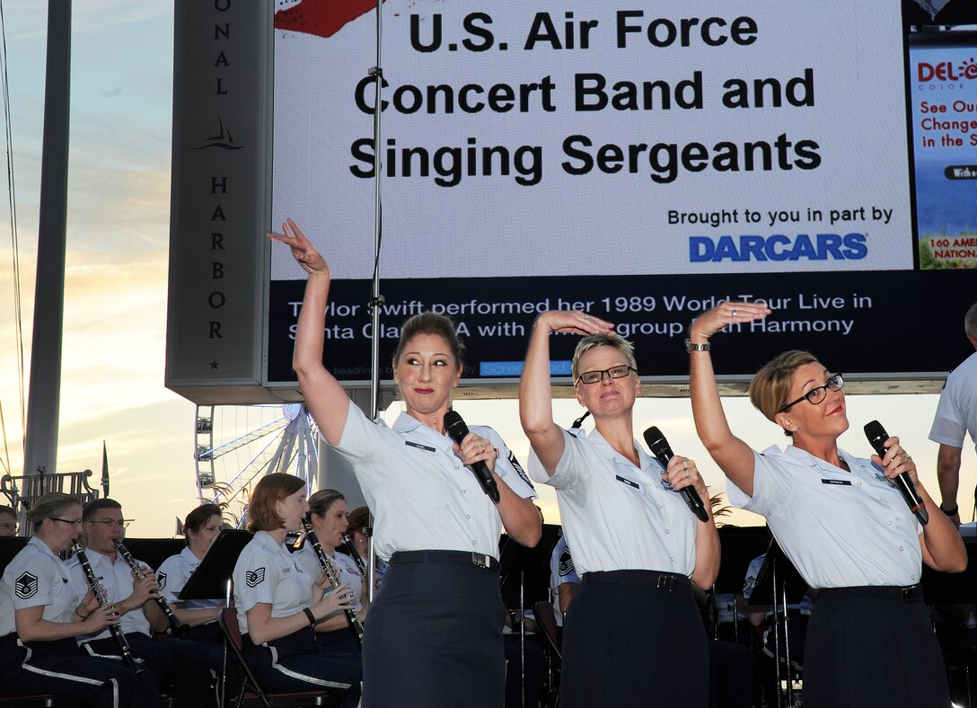 Members of the U.S. Air Force Singing Sergeants perform at the National Harbor Plaza stage, MD on Aug. 15, 2015. The performance commemorated the 70th anniversary of the end of World War II and celebrated "The Greatest Generation," featuring music from or related to the World War II era and was in honor of our World War II veterans. The Concert Band and Singing Sergeants are stationed at Joint Base Anacostia-Bolling in Washington, D.C. (U.S. Air Force photo/James E. Lotz).