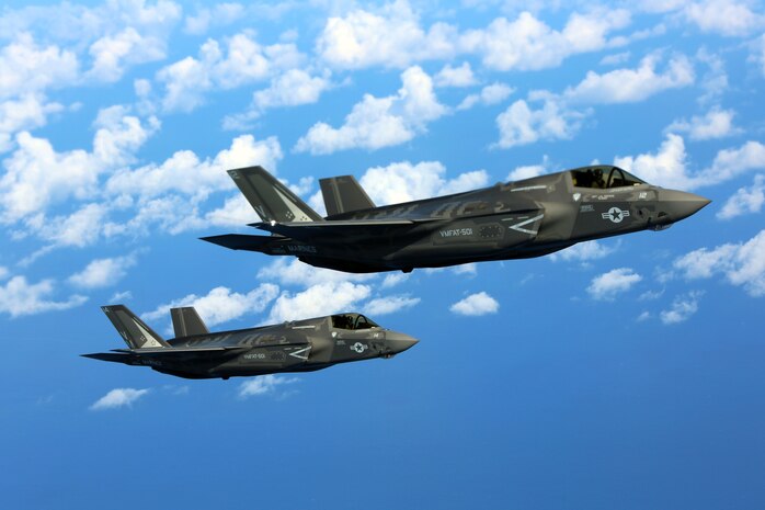 Two F-35B joint strike fighter jets conduct aerial maneuvers during aerial refueling training over the Atlantic Ocean, Aug. 13, 2015. The mission of Marine Fighter Attack Training Squadron 501 is to conduct effective training and operations in the F-35B in coordination with joint and coalition partners in order to successfully attain the annual pilot training requirement. VMFAT-501 is based at Marine Corps Air Station Beaufort, South Carolina. (U.S. Marine Corps photo by Cpl. N.W. Huertas/Released)

