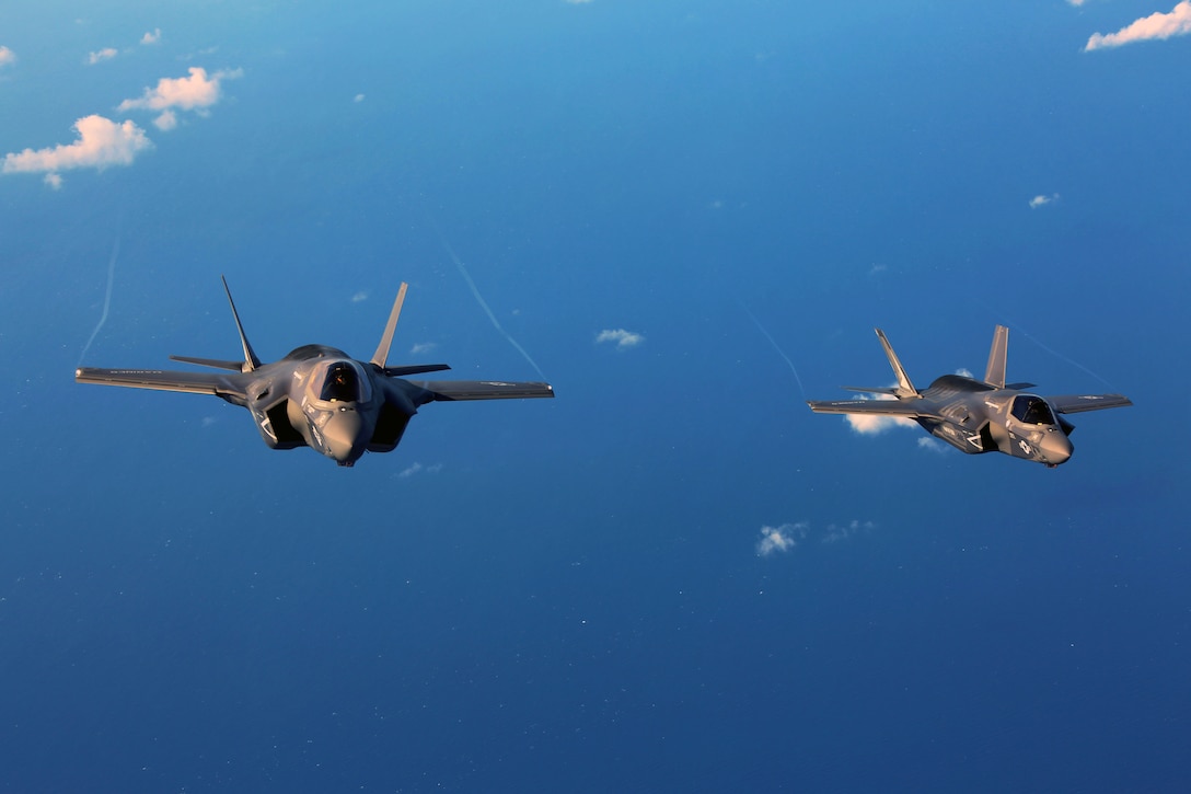 Two F-35B joint strike fighter jets conduct aerial maneuvers during aerial refueling training over the Atlantic Ocean, Aug. 13, 2015. The mission of Marine Fighter Attack Training Squadron 501 is to conduct effective training and operations in the F-35B in coordination with joint and coalition partners in order to successfully attain the annual pilot training requirement. VMFAT-501 is based at Marine Corps Air Station Beaufort, South Carolina. (U.S. Marine Corps photo by Cpl. N.W. Huertas/Released)
