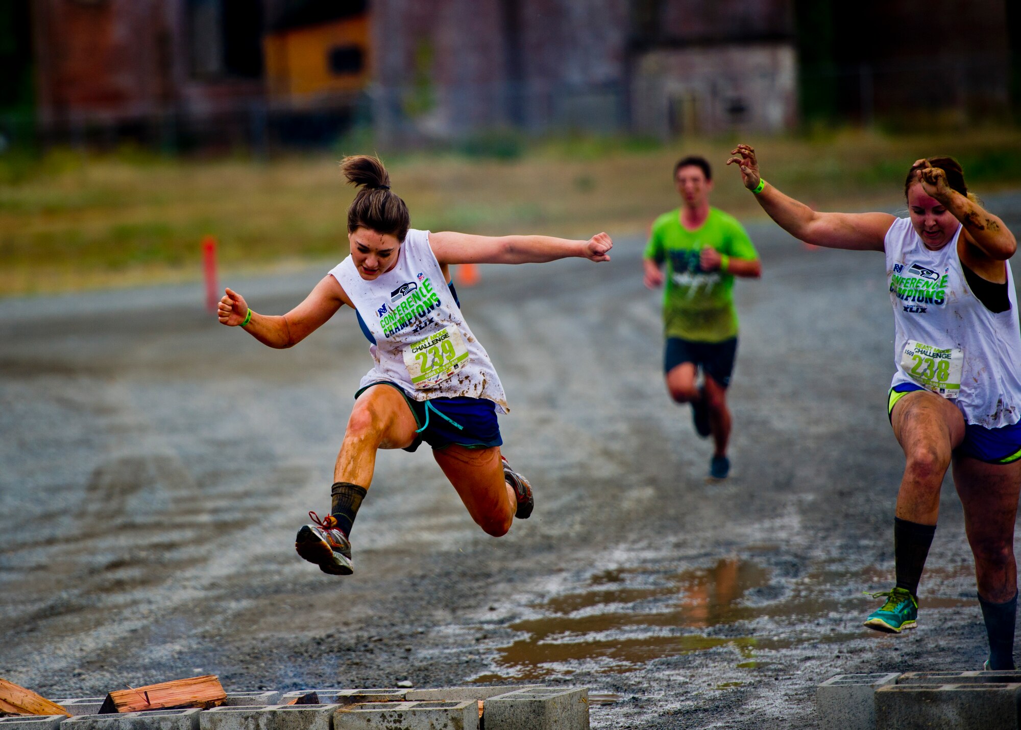 A participant in the Beast Mode Challenge sponsored by the Air Force Reserve, races through an obstacle course in Snoqualmie, Wash., Aug. 15, 2015. The challenge was composed of a 3.5-mile mud-ridden obstacle course - with 12 football-themed trials of hills, blockades, water, and sludge, created to trigger one's inner Beast Mode. A portion of the race proceeds and 100% of donations went directly to the Fam 1st Family Foundation co-founded by Marshawn ‘Beast Mode’ Lynch of the Seattle Seahawks. The Fam 1st Family Foundation is dedicated to uplifting and empowering youth in the Bay Area and throughout the United States. The foundation’s mission is one of empowerment and education,aiming to build self-esteem and academic learning skills in underprivileged youth. (U.S. Air Force photo/Senior Airman Daniel Liddicoet)