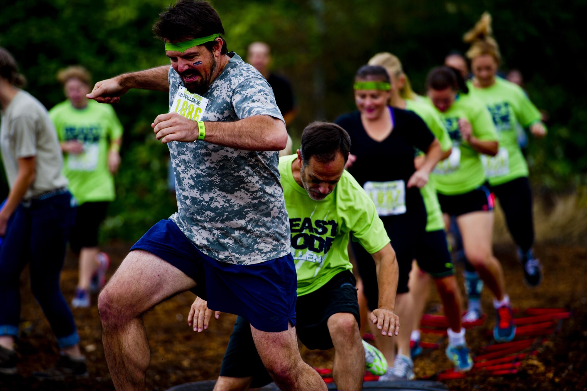 Participants in the Beast Mode Challenge sponsored by the Air Force Reserve, races through an obstacle course in Snoqualmie, Wash., Aug. 15, 2015. The challenge was composed of a 3.5-mile mud-ridden obstacle course - with 12 football-themed trials of hills, blockades, water, and sludge, created to trigger one's inner Beast Mode. A portion of the race proceeds and 100% of donations went directly to the Fam 1st Family Foundation co-founded by Marshawn ‘Beast Mode’ Lynch of the Seattle Seahawks. The Fam 1st Family Foundation is dedicated to uplifting and empowering youth in the Bay Area and throughout the United States. The foundation’s mission is one of empowerment and education,aiming to build self-esteem and academic learning skills in underprivileged youth. (U.S. Air Force photo/Senior Airman Daniel Liddicoet)
