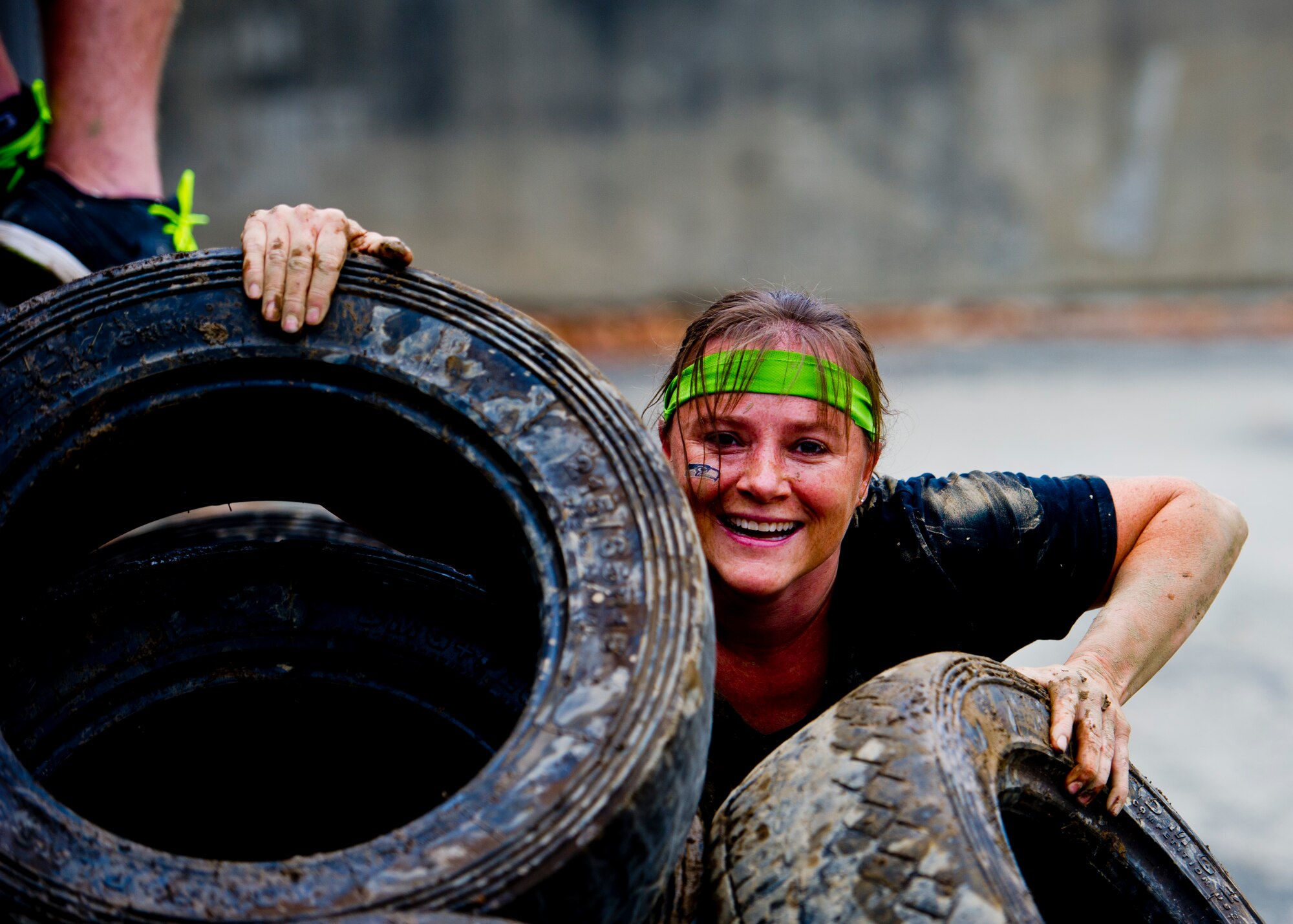 A participant in the Beast Mode Challenge sponsored by the Air Force Reserve, races through an obstacle course in Snoqualmie, Wash., Aug. 15, 2015. The challenge was composed of a 3.5-mile mud-ridden obstacle course - with 12 football-themed trials of hills, blockades, water, and sludge, created to trigger one's inner Beast Mode. A portion of the race proceeds and 100% of donations went directly to the Fam 1st Family Foundation co-founded by Marshawn ‘Beast Mode’ Lynch of the Seattle Seahawks. The Fam 1st Family Foundation is dedicated to uplifting and empowering youth in the Bay Area and throughout the United States. The foundation’s mission is one of empowerment and education,aiming to build self-esteem and academic learning skills in underprivileged youth. (U.S. Air Force photo/Senior Airman Daniel Liddicoet)
