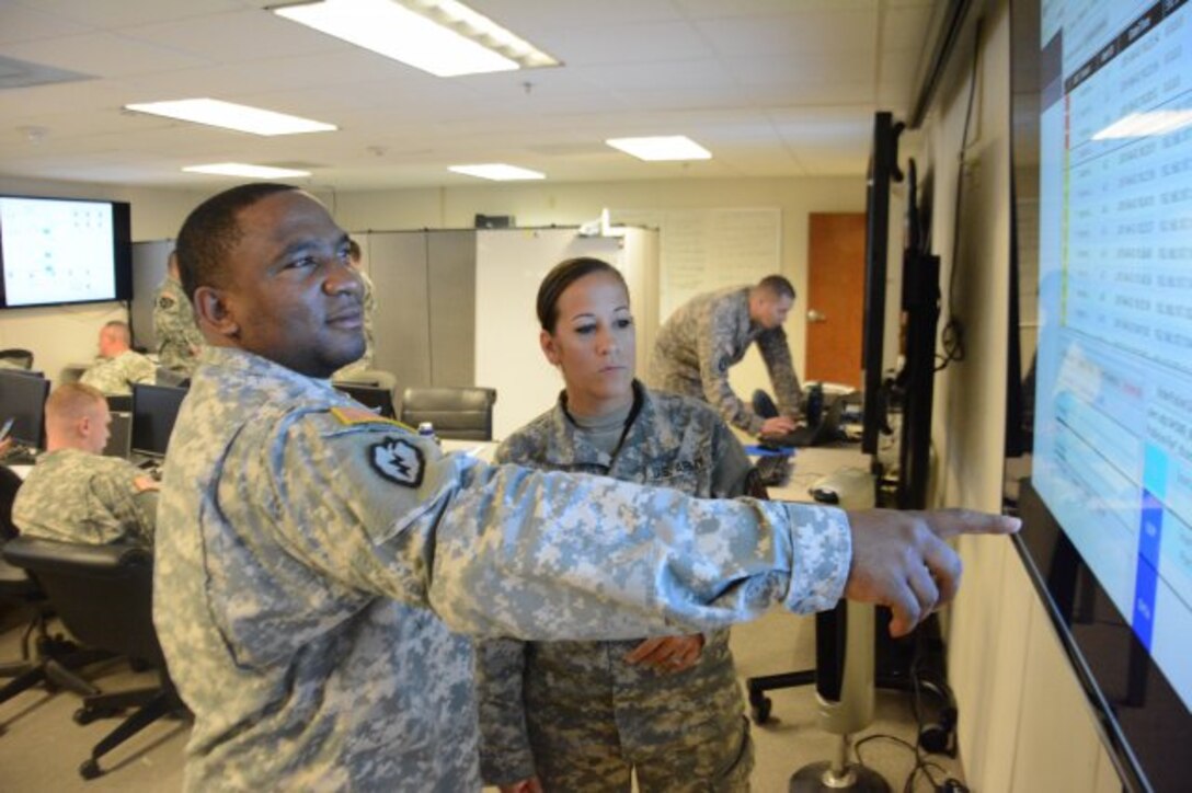 Members of a 7th Signal Command Cyber Protection Team work in a virtual