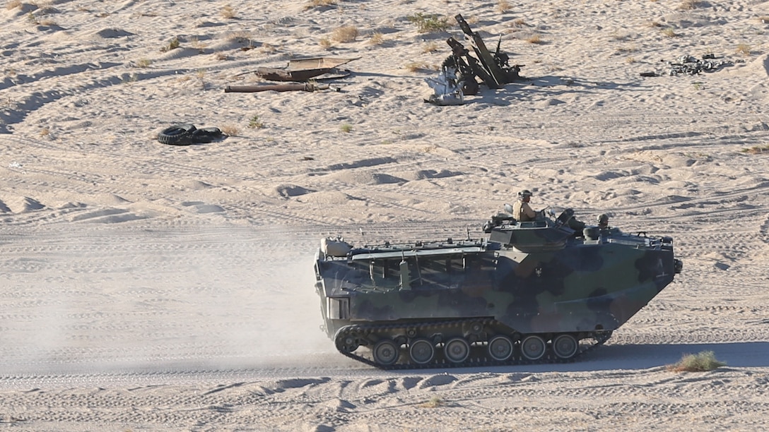 An assault amphibious vehicle carrying Marines with 1st Battalion, 7th Marine Regiment, travel to an objective point during a scenario-based event during Large Scale Exercise 15 at Marine Corps Air Ground Combat Center Twentynine Palms, California, Aug. 16, 2015. LSE-15 is a combined U.S. Marine Corps, Canadian and British Exercise conducted at the brigade level, designed to enable live, virtual and constructive training for participating forces.