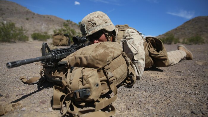 A Marine with 1st Battalion, 3rd Marine Regiment sights in on a target in a preparatory exercise for Large Scale Exercise 15 at Marine Corps Air Ground Combat Center Twentynine Palms, California, Aug. 11, 2015. LSE-15 is a combined U.S. Marine Corps, Canadian Band British Exercise conducted at the brigade level, designed to enable live, virtual and constructive training for participating forces.