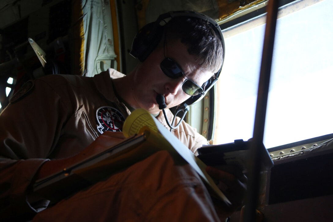 Sgt. Chris McClellan reviews in-flight procedures during aerial refueling training near Marine Corps Air Station Beaufort, South Carolina, Aug. 13, 2015. Marine Aerial Refueler Transport Squadron 252’s mission is to is to support the Marine Air-Ground Task Force commander by providing air-to-air refueling, assault support, and offensive air support, day or night under all weather conditions during expeditionary, joint, or combined operations. VMGR-252 is based out of Marine Corps Air Station Cherry Point, North Carolina. McClellan is a crew master with the squadron. (U.S. Marine Corps photo by Cpl. N.W. Huertas/Released)
