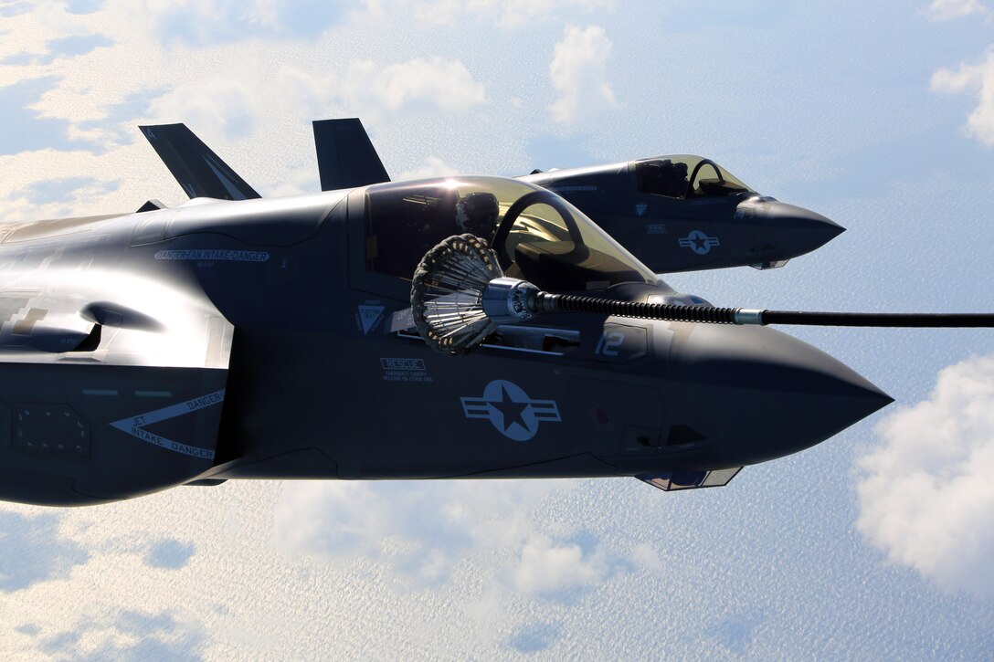 Two F-35B joint strike fighter jets conduct aerial maneuvers during training over the Atlantic Ocean, Aug. 13, 2015. The mission of Marine Fighter Attack Training Squadron 501 is to conduct effective training and operations in the F-35B in coordination with joint and coalition partners in order to successfully attain the annual pilot training requirement. VMFAT-501 is based at Marine Corps Air Station Beaufort, South Carolina. (U.S. Marine Corps photo by Cpl. N.W. Huertas/Released)
