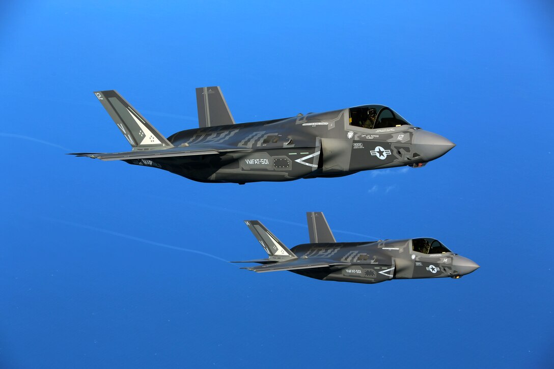 Two F-35B joint strike fighter Jets conduct aerial maneuvers during aerial refueling training over the Atlantic Ocean, Aug. 13, 2015. The mission of Marine Fighter Attack Training Squadron 501 is to conduct effective training and operations in the F-35B in coordination with joint and coalition partners in order to successfully attain the annual pilot training requirement. VMFAT-501 is based at Marine Corps Air Station Beaufort, South Carolina. (U.S. Marine Corps photo by Cpl. N.W. Huertas/Released)
