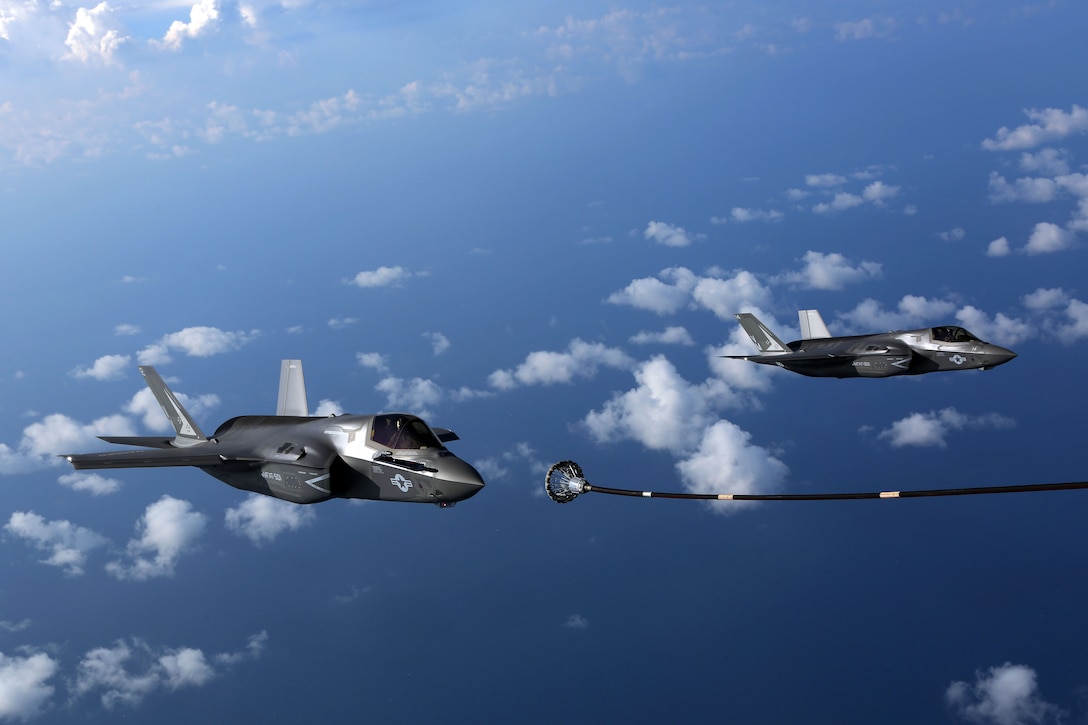 Two F-35B joint strike fighter jets approach the fuel line of a KC-130J Super Hercules during aerial refueling training over the Atlantic Ocean, Aug. 13, 2015. The mission of Marine Fighter Attack Training Squadron 501 is to conduct effective training and operations in the F-35B in coordination with joint and coalition partners in order to successfully attain the annual pilot training requirement. VMFAT-501 is based at Marine Corps Air Station Beaufort, South Carolina and VMGR-252 is based at Marine Corps Air Station Cherry Point. (U.S. Marine Corps photo by Cpl. N.W. Huertas/Released)
