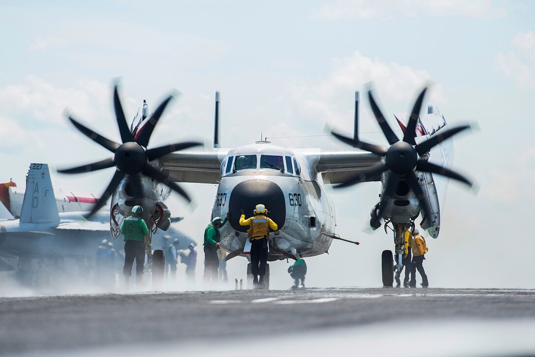 U.S. sailors direct an C-2A Greyhound on the flight deck of the aircraft carrier USS Harry S. Truman in the Atlantic Ocean, Aug. 14, 2015. The carrier is conducting carrier qualifications to prepare for its upcoming deployment. The Greyhound is assigned to Fleet Logistic Support Squadron 40. U.S. Navy photo by Petty Officer 3rd Class E. T. Miller