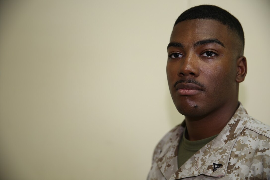 Lance Cpl. Nathan Battle, an administration specialist currently deployed with Marine Wing Support Squadron - 371, Special Purpose Marine Air-Ground Task Force – Crisis Response – Central Command from St. Louis, Missouri, poses for a portrait while deployed in Southwest Asia, Aug. 18, 2015. Battle said his religious beliefs act as his foundation, his philosophy, and way of life aimed at developing himself, others, and the Marine Corps.