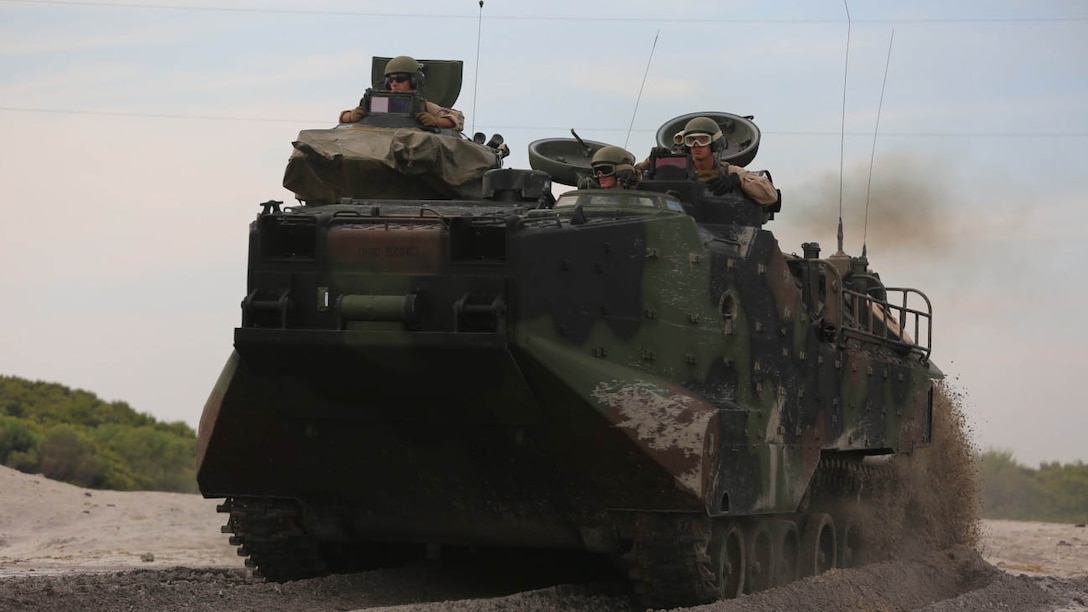 An amphibious assault vehicle with 1st Platoon, Bravo Company, 2nd Assault Amphibian Battalion makes its way to the beach prior to pushing through the surf on Onslow Beach aboard Camp Lejeune, N.C. Aug. 17, 2015. AAV’s are made for the purpose of going from ship to shore and back with ease.