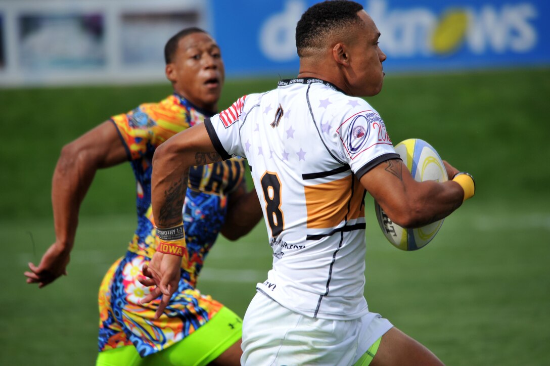 Spc. Stephen Johnson of Fort Bragg, N.C., helps All-Army to a come-from-behind 19-12 victory over All-Navy in the 2015 Armed Forces Rugby Sevens Championship on Friday at Infinity Park in Glendale, Colo. With the victory, All-Army improved to 2-0 in the tournament. The Soldiers are scheduled to play All-Coast Guard tonight at 6:52 MT. U.S. Army photo by Tim Hipps, IMCOM Public Affairs