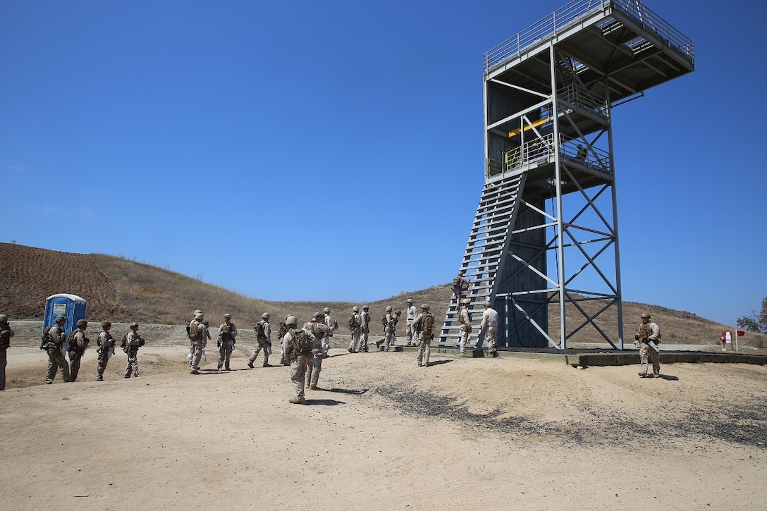 Marines assigned to Company A, 1st Reconnaissance Battalion, 1st Marine Division, prepare to rappel out of tower as part of Helicopter Rope Suspension Techniques training aboard Marine Corps Base Camp Pendleton, Calif., Aug. 17, 2015. Fast-roping is the most commonly used insertion tactic for Reconnaissance Marines during training or real-life missions. (U.S. Marine photo by Cpl. Will Perkins)