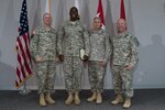 Army Lt. Gen. Timothy Kadavy, left, director of the Army National Guard, stands with Army Sgt. Amadou Traore, a recruiting and retention noncommissioned officer with the Pennsylvania Army National Guard, and other senior leaders during an award ceremony at Arlington Hall, Aug. 3, 2015 in Arlington, Virginia. Traore was awarded the Army Commendation Medal for enlisting 18 new recruits during the Army Guard's 9 in 90 Recruiting Challenge. 