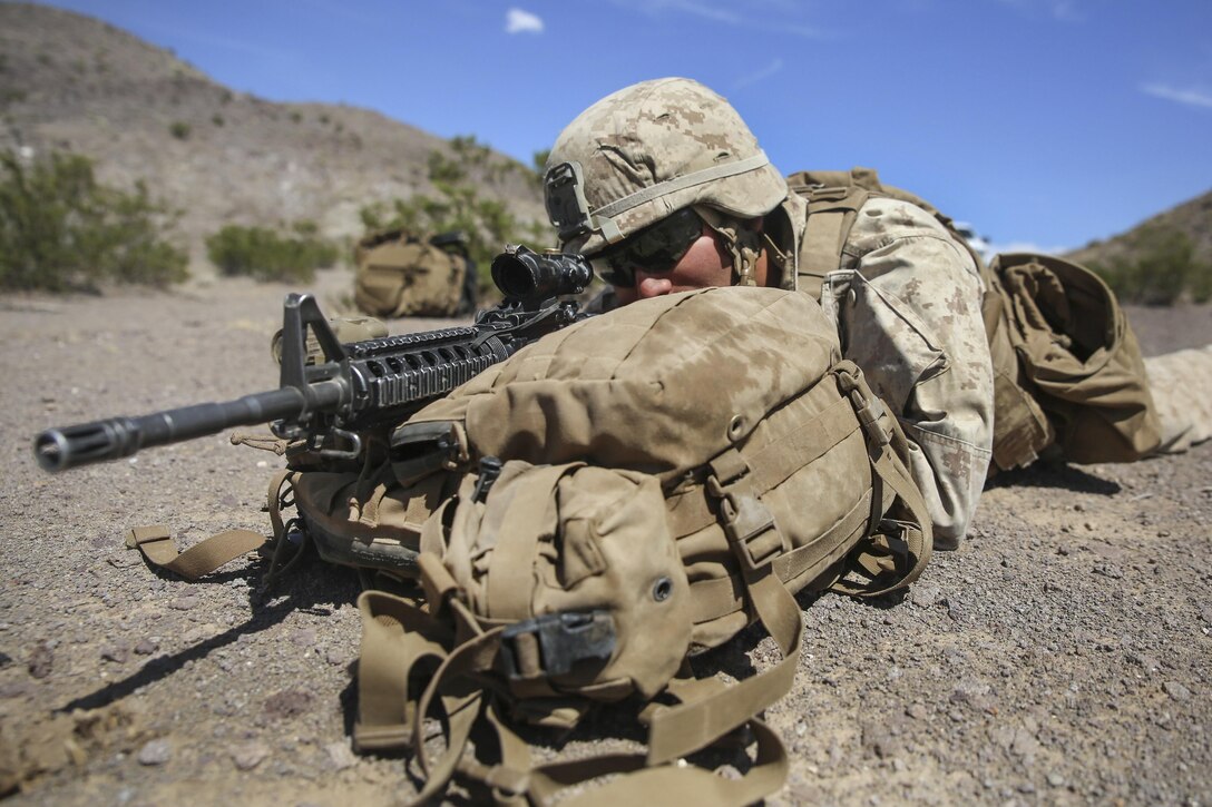 A Marine aims at a target to prepare for Large Scale Exercise 15 on Marine Corps Air Ground Combat Center Twentynine Palms, Calif., Aug. 11, 2015. The brigade-level exercise includes international forces to enable live, virtual and constructive training. The Marine is assigned to 1st Battalion, 3rd Marine Regiment. U.S. Marine Corps photo by Lance Cpl. Chris Garcia