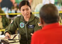 Philippine Air Force Capt. Jacquelyn Corpuz, a PAF flight nurse, questions a patient about his general heath during Pacific Angel’s healthcare services outreach, Bohol Province, Philippines, Aug. 16, 2015. The healthcare services outreach program provided general care, optometry services, dental care, physical therapy and a pharmacy. Pacific Angel is a multilateral humanitarian assistance civil military operation, which improves military-to-military partnerships in the Pacific while also providing medical health outreach, civic engineering projects and subject matter exchanges among partner forces.(U.S. Air Force photo by Tech. Sgt. Aaron Oelrich/Released)