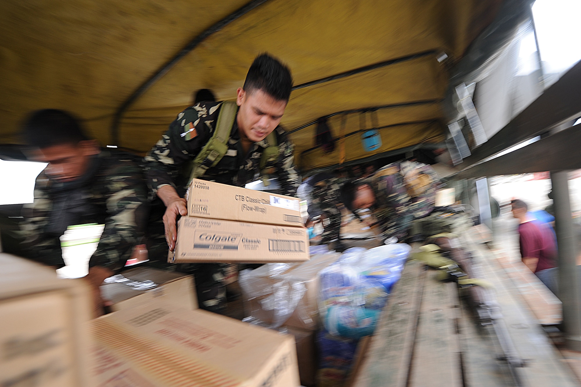 Members of the Armed Forces of the Philippines and U.S. military members transfer supplies from a U.S. Air Force C-130 Hercules with the 133rd Airlift Wing to an Armed Forces of the Philippines vehicle in support of Operation Pacific Angel Philippines at Tagbiliran Airport, Philippines, Aug. 13, 2015. Pacific Angel is a multilateral humanitarian assistance civil military operation, which improves military-to-military partnerships in the Pacific while also providing medical health outreach, civic engineering projects and subject matter exchanges among partner forces. (U.S. Air Force photo by Tech. Sgt. Aaron Oelrich/Released)