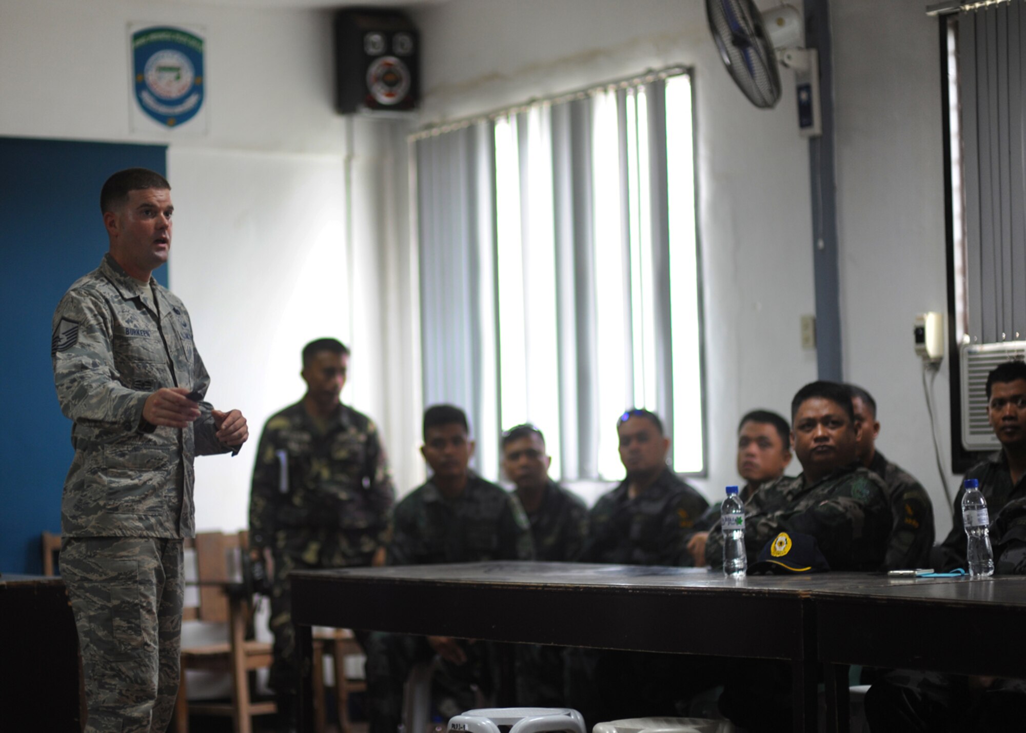 U.S. Air Force Master Sgt. Jeremy Burkeen, from 736th Security Forces Squadron at Andersen Air Force Base, Guam, discusses non-lethal crowd control techniques with members of the Philippines national police and Armed Forces of the Philippines during Pacific Angel in Tagbiliran City, Philippines, Aug. 16, 2015. Efforts undertaken during Pacific Angel help multilateral militaries in the Pacific improve and build relationships across a wide spectrum of civic operations, which bolsters each nation’s capacity to respond and support future humanitarian assistance and disaster relief operations. (U.S. Air Force photo by Tech. Sgt. Aaron Oelrich/Released)