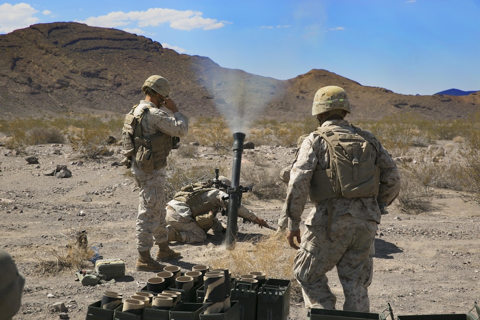 Marines with 1st Battalion, 3rd Marine Regiment, provide mortar fire in support of Large Scale Exercise 15 in the vicinity of the Blacktop Training Area, Aug. 15, 2015. During the exercise, 1st Battalion, 7th Marine Regiment, provided live artillery supporting fire for a ground combat element as they assaulted two objectives. (Official Marine Corps photo by Cpl. Charles Santamaria/Released)
