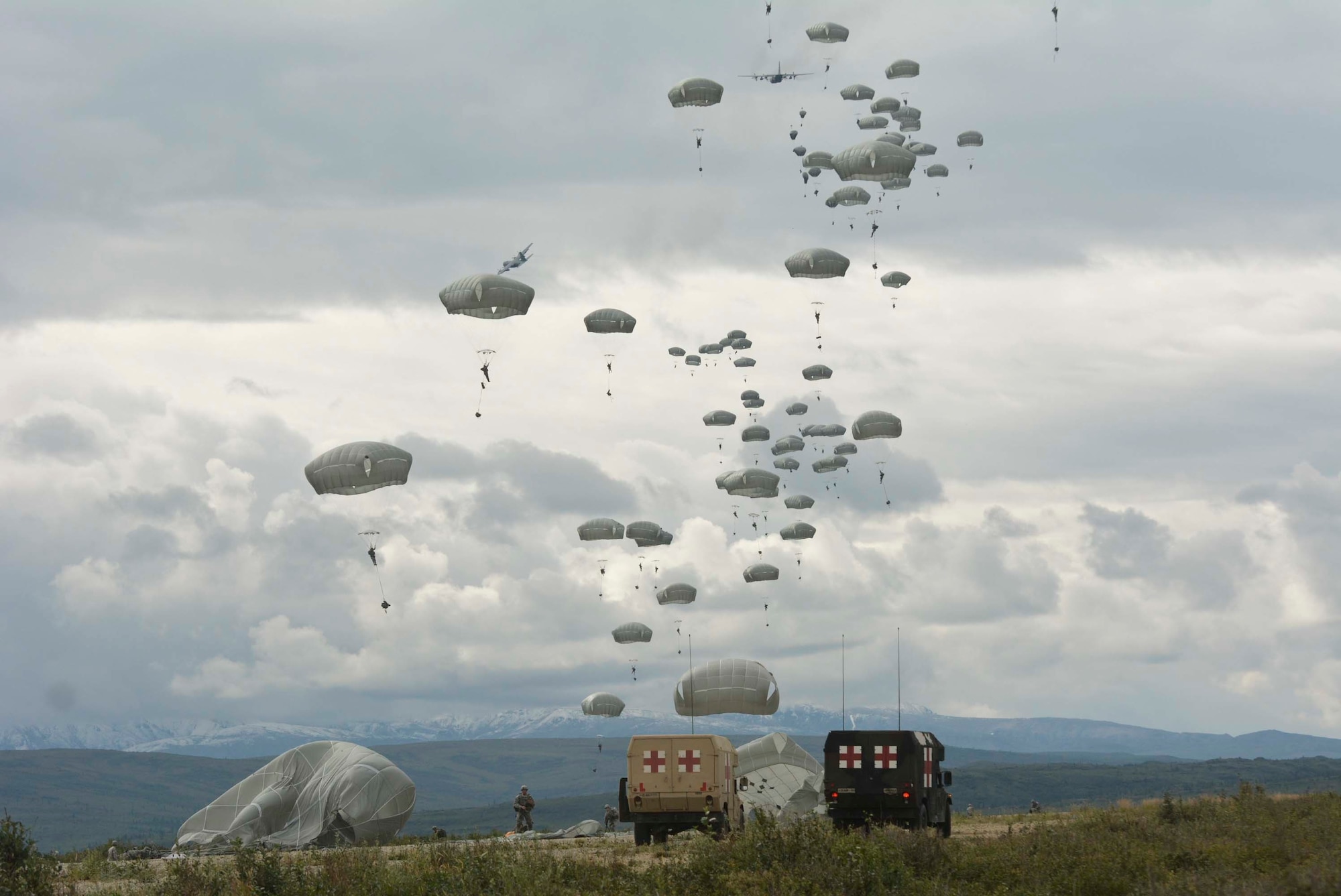 Japan Ground Self-Defense Forces from the 1st Airborne Brigade and 4th Brigade (Airborne), 25th Infantry Division paratroopers perform an airborne insertion and airfield seizure at Fort Greely, Alaska, Aug. 12. This event was part of Exercise Arctic Aurora 2015. (U.S. Army photo by Staff Sgt. Daniel Love)