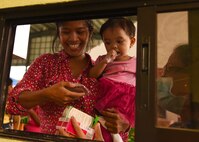 Rayian Carazon and daughter Trica, of Lila, Bohol province, Philippines, receive medication proscribed during the Health Services Outreach provided as part of the Pacific Angel Philippines mission taking place in Lila, Bohol province, Philippines, Aug. 16, 2015. Efforts undertaken during Pacific Angel help multilateral militaries in the Pacific improve and build relationships across a wide spectrum of civic operations, which bolsters each nation’s capacity to respond and support future humanitarian assistance and disaster relief operations. (U.S. Air Force photo by Tech. Sgt. Aaron Oelrich/Released)