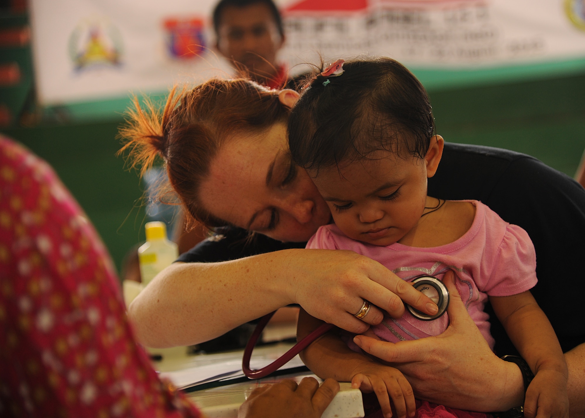 Royal Australian Air Force Cpl. Mia Woolley, medical technician, conducts a medical screening on Trica, a 1-year-old from Lila, Bohol province, Philippines, during the Health Services Outreach provided as part of the Pacific Angel Philippines mission taking place in Lila, Bohol province, Philippines, Aug. 16, 2015. Efforts undertaken during Pacific Angel help multilateral militaries in the Pacific improve and build relationships across a wide spectrum of civic operations, which bolsters each nation’s capacity to respond and support future humanitarian assistance and disaster relief operations. (U.S. Air Force photo by Tech. Sgt. Aaron Oelrich/Released)