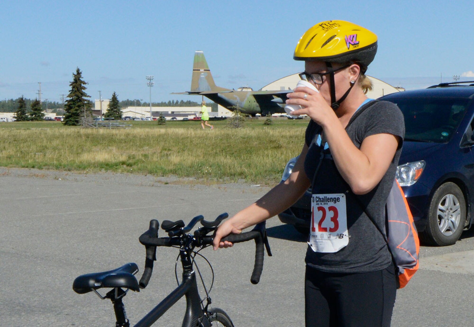 Senior Airman Therese Holm, 673rd Medical Operations Squadron, takes a break after finishing the 17-mile bike race on Joint Base Elmendorf-Richardson, Alaska, August 14, 2015. Holm was awarded a prize for being the first female participant to finish the race. (U.S. Air Force photo/Airman Valerie A. Monroy)
