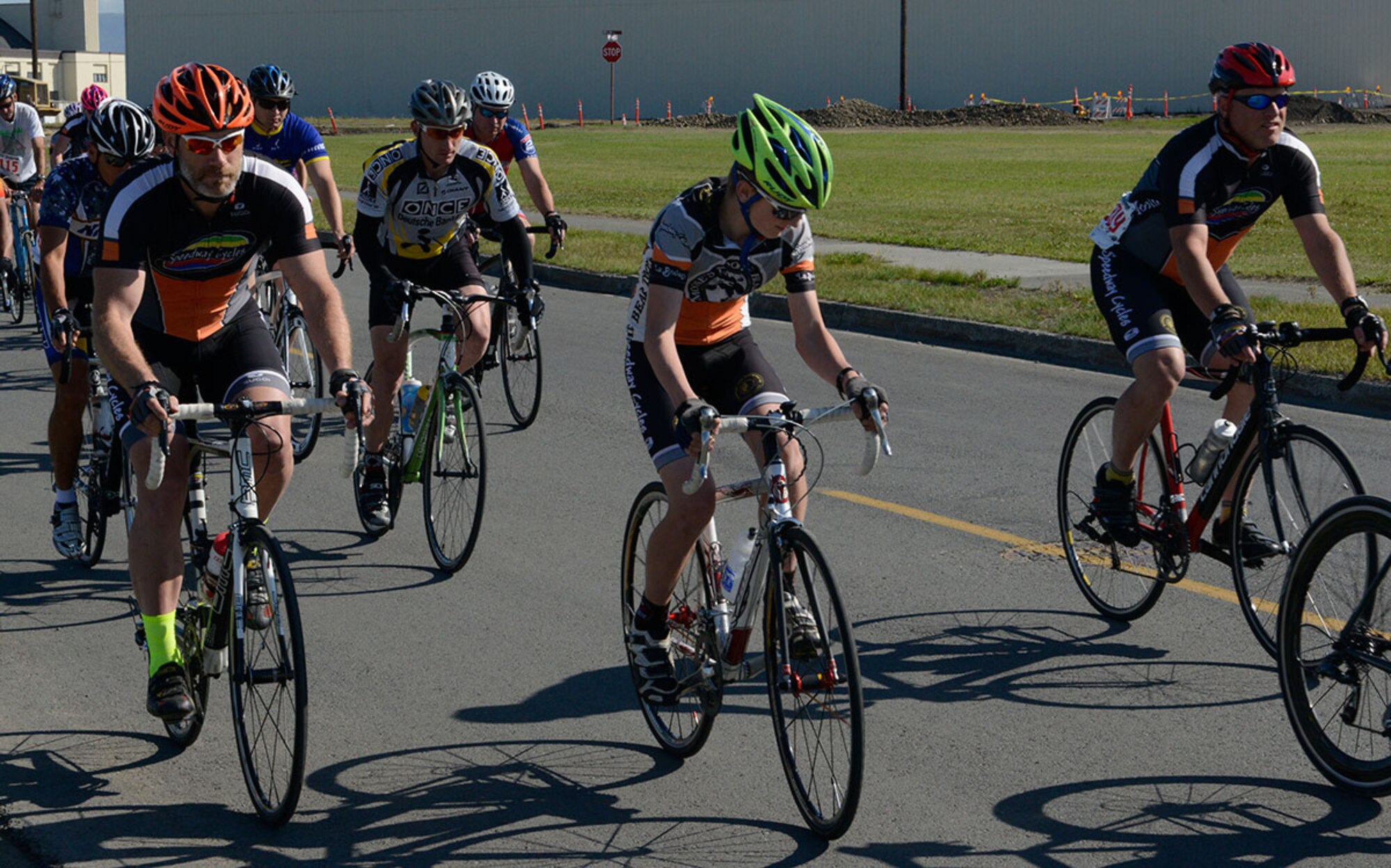 Participants begin a 17-mile bike race on Joint Base Elmendorf-Richardson, Alaska, August 14, 2015. Members provided their own bikes and helmets for the race. (U.S. Air Force photo/Airman Valerie A. Monroy)