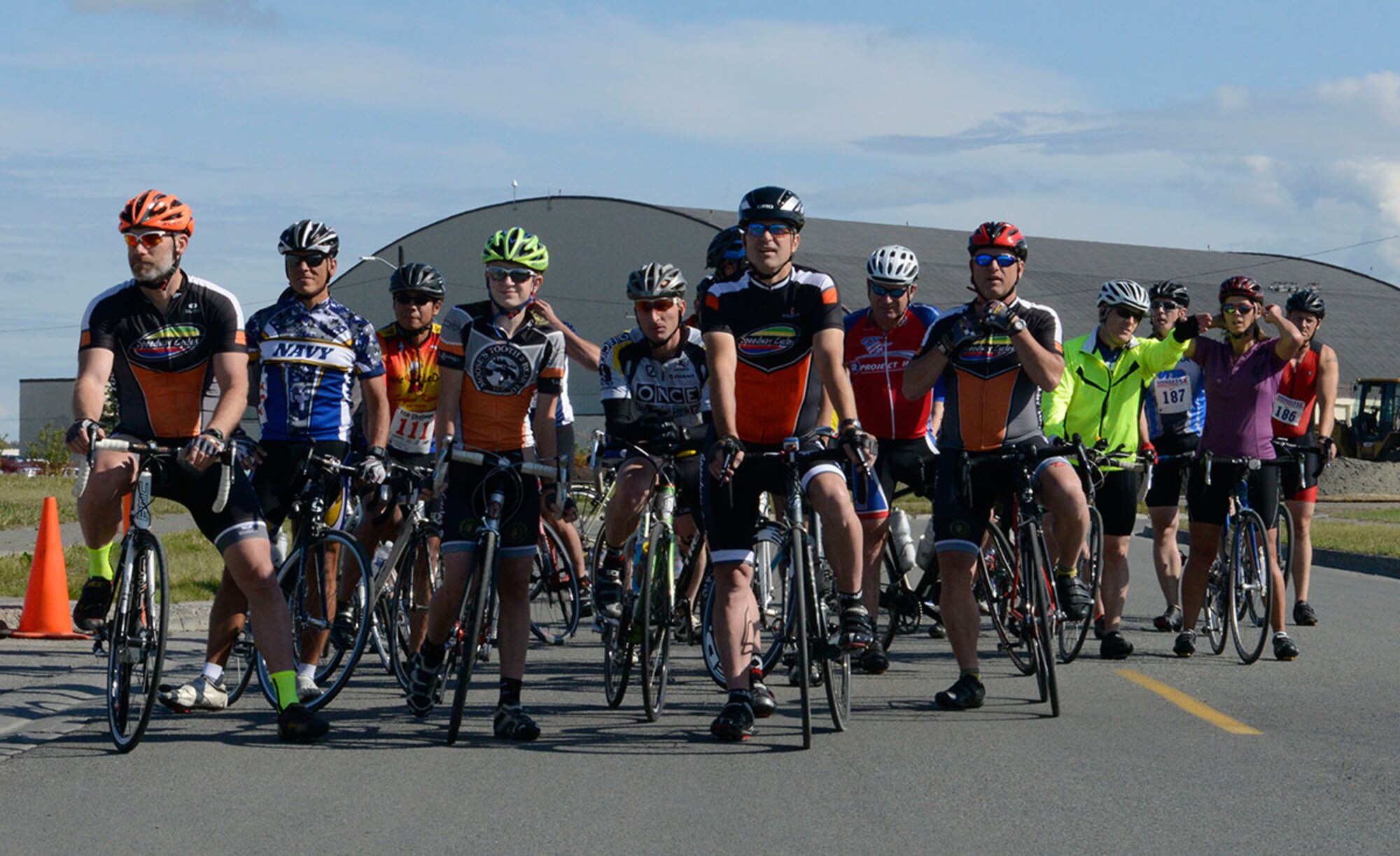 Participants line up at the start of a 17-mile bike race on Joint Base Elmendorf-Richardson, Alaska, August 14, 2015. Twenty-six people raced in the event. (U.S. Air Force photo/Airman Valerie A. Monroy)