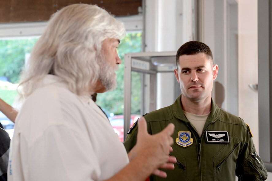 Capt. Matthew Lund, 8th Airlift Squadron C-17 Globemaster III pilot, talks with Bill Wichrowski, “Deadliest Catch” boat captain May 29, 2015, in Seattle, Wash. During “Captain to Captain,” a segment on “The Bait,” Lund shared stories with the crew, on and off camera, such as leading the crew and working with problems. (U.S. Air Force photo/Airman 1st Class Keoni Chavarria)