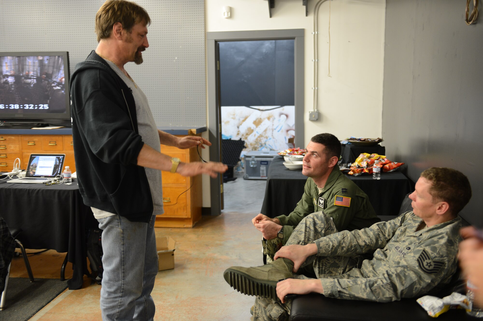 Capt. Matthew Lund (middle), 8th Airlift Squadron C-17 Globemaster III pilot, talks with Johnathan Hillstrand, “Deadliest Catch” boat captain May 29, 2015, in Seattle, Wash. During the taping of “Captain to Captain,” a segment on the show “The Bait,” Lund spoke about the C-17 and some of the missions it flies on. (U.S. Air Force photo/Airman 1st Class Keoni Chavarria)