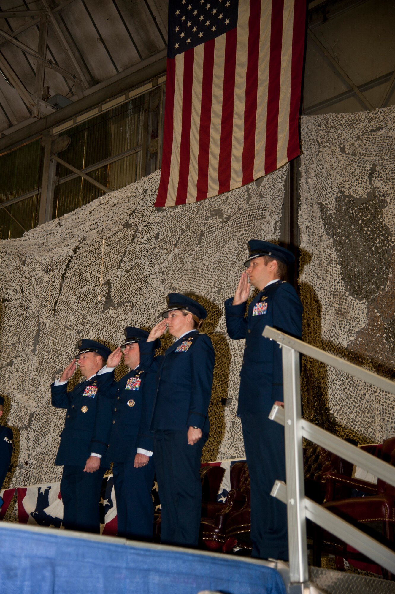 Col. Dagvin Anderson, 58th Special Operations Wing commander, Col. Jonathan Duncan, 336th Training Group commander, Col. Shelley Rodriguez, 58th Operations Group commander and Lt. Col. Jason Snyder, 36th Rescue Squadron commander, salute while the national anthem is played Aug. 14, 2015, at Fairchild Air Force Base, Wash. The commanders were gathered for the 36th RQS re-designation ceremony. (U.S. Air Force photo/Airman 1st Class Taylor Bourgeous)