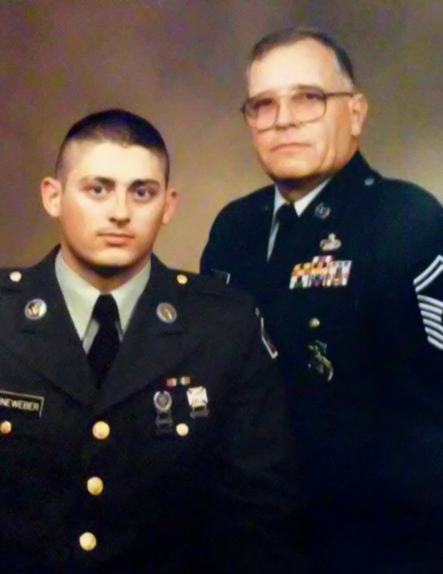 Retired Chief Master Sgt. Charles E. Turner, and his son, U.S. Army Private Jeff Leineweber, pose for a photo in their uniforms in 1991. Turner provided advice and inspiration to his other son, Tech. Sgt. Matthew Turner, as Matthew progressed through his career. (Courtesy Photo)